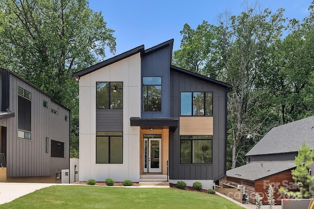 1727 Seifert Cir, Charlotte, NC 28205 - contemporary house featuring a front yard and board and batten siding