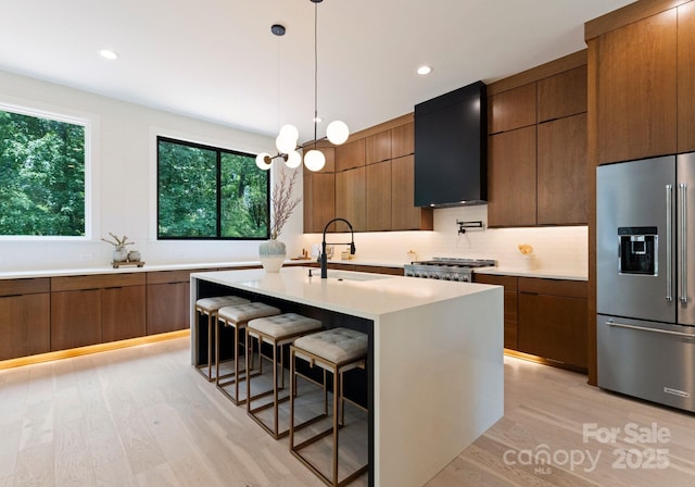 1727 Seifert Cir, Charlotte, NC 28205 - kitchen featuring high quality fridge, exhaust hood, modern cabinets, light countertops, and recessed lighting