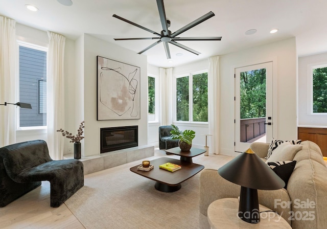 1727 Seifert Cir, Charlotte, NC 28205 - living area featuring light wood-style flooring, recessed lighting, a fireplace, and ceiling fan