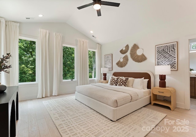 1727 Seifert Cir, Charlotte, NC 28205 - bedroom featuring multiple windows, vaulted ceiling, light wood-type flooring, and recessed lighting