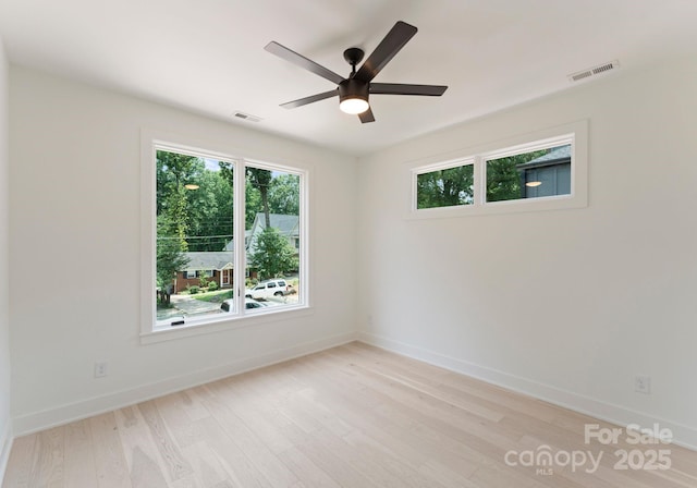 1727 Seifert Cir, Charlotte, NC 28205 - spare room with light wood finished floors and a ceiling fan