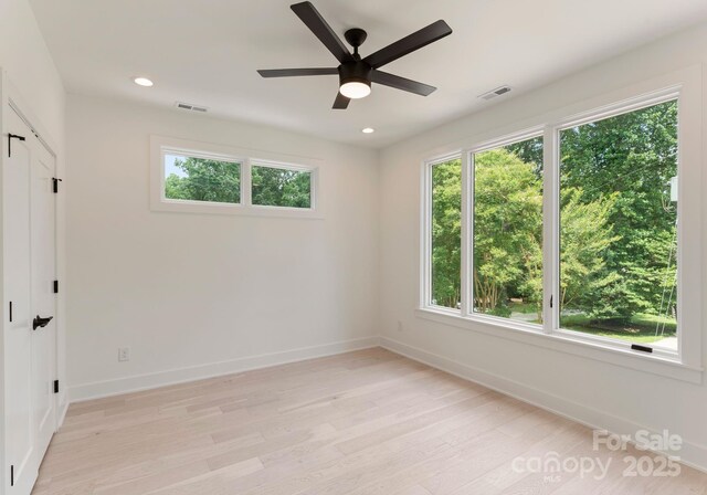 1727 Seifert Cir, Charlotte, NC 28205 - unfurnished bedroom with light wood-style floors, recessed lighting, and ceiling fan