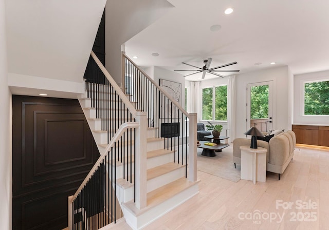 1727 Seifert Cir, Charlotte, NC 28205 - stairway featuring wood finished floors, a ceiling fan, recessed lighting, and wainscoting