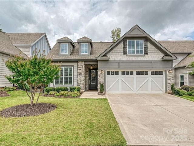 2034 Laney Pond Rd, Matthews, NC 28104 - craftsman house with driveway, a front yard, roof with shingles, and an attached garage