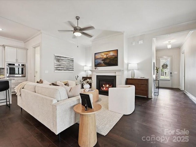 2034 Laney Pond Rd, Matthews, NC 28104 - living room with ornamental molding, dark wood finished floors, ceiling fan, and a glass covered fireplace