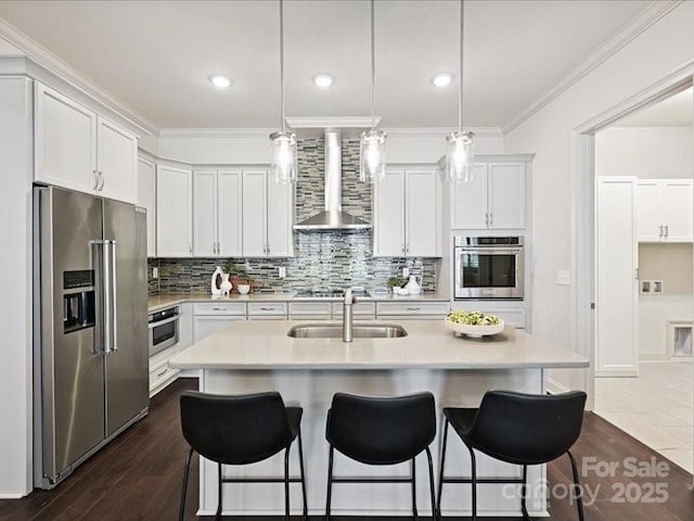2034 Laney Pond Rd, Matthews, NC 28104 - kitchen with appliances with stainless steel finishes, wall chimney exhaust hood, light countertops, a breakfast bar, and decorative backsplash
