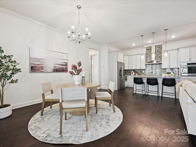 2034 Laney Pond Rd, Matthews, NC 28104 - dining space featuring a chandelier, dark wood-style flooring, ornamental molding, and recessed lighting