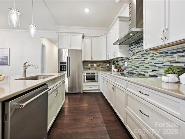2034 Laney Pond Rd, Matthews, NC 28104 - kitchen featuring appliances with stainless steel finishes, wall chimney exhaust hood, light countertops, ornamental molding, and white cabinetry