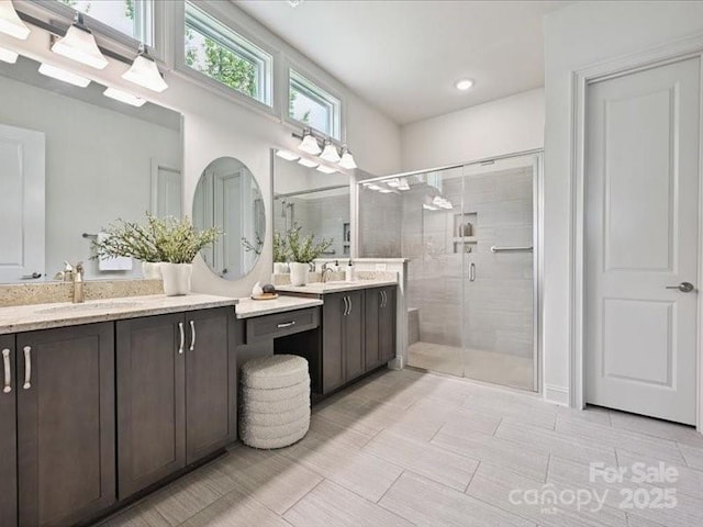2034 Laney Pond Rd, Matthews, NC 28104 - bathroom featuring double vanity and a stall shower