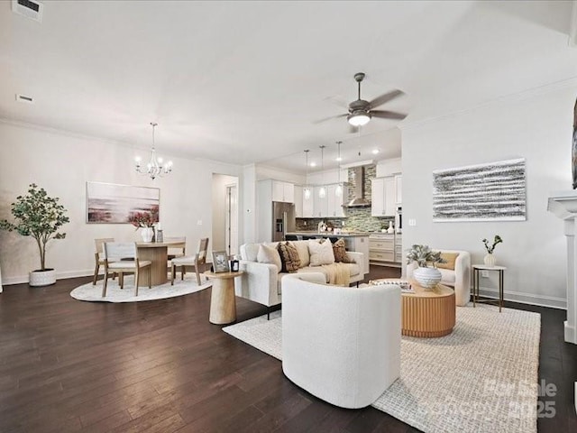 2034 Laney Pond Rd, Matthews, NC 28104 - living room with dark wood-style flooring, ceiling fan, ornamental molding, and a chandelier