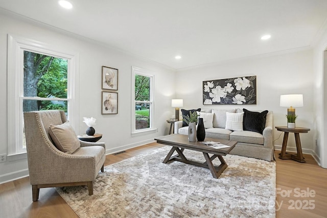6542 Cross Field Ln, Charlotte, NC 28226 - living area with ornamental molding, wood finished floors, and recessed lighting