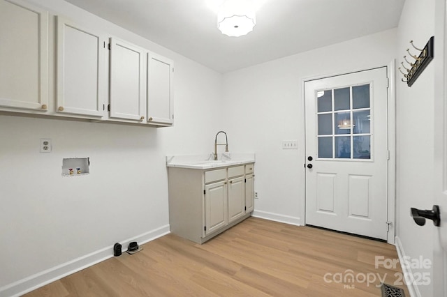 6542 Cross Field Ln, Charlotte, NC 28226 - laundry area with hookup for a washing machine, light wood finished floors, and cabinet space