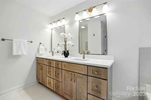 6542 Cross Field Ln, Charlotte, NC 28226 - bathroom featuring double vanity and baseboards