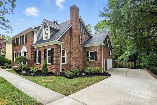 6542 Cross Field Ln, Charlotte, NC 28226 - view of property exterior featuring a chimney, brick siding, driveway, and a garage