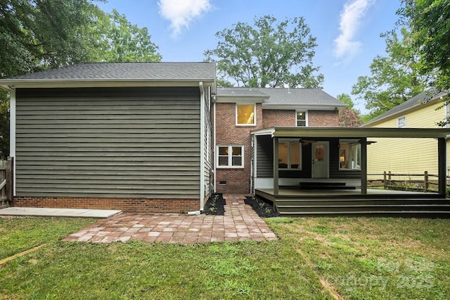 6542 Cross Field Ln, Charlotte, NC 28226 - rear view of house featuring a wooden deck, a lawn, a patio, and brick siding