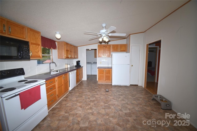 8221 Feather Run Rd, Kershaw, SC 29067 - kitchen featuring white appliances, washer and clothes dryer, a ceiling fan, stone finish flooring, and brown cabinetry