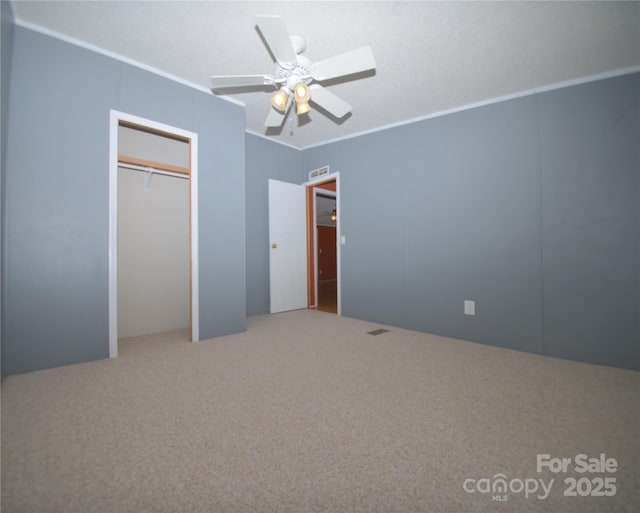 8221 Feather Run Rd, Kershaw, SC 29067 - unfurnished bedroom featuring crown molding, carpet, a closet, and ceiling fan