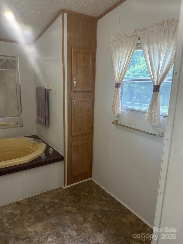 8221 Feather Run Rd, Kershaw, SC 29067 - bathroom with a textured ceiling and a garden tub