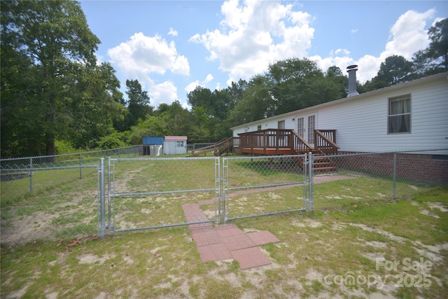 8221 Feather Run Rd, Kershaw, SC 29067 - fenced yard with a gate, a wooden deck, and french doors