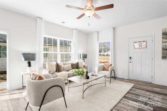 167 Dry Dock Loop, Mooresville, NC 28117 - living area featuring healthy amount of natural light, wood finished floors, and a ceiling fan