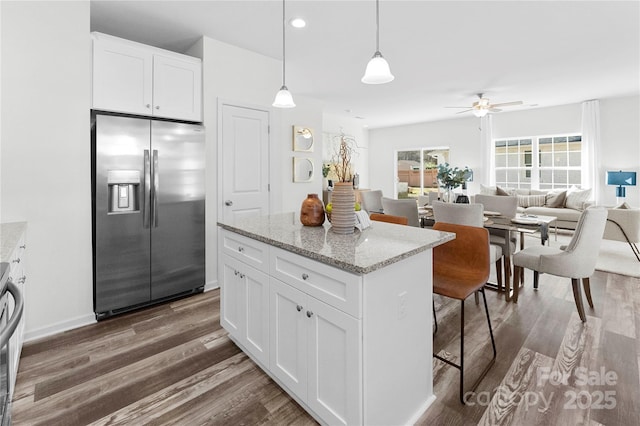 167 Dry Dock Loop, Mooresville, NC 28117 - kitchen with stainless steel fridge with ice dispenser, dark wood-type flooring, a ceiling fan, a center island, and white cabinetry