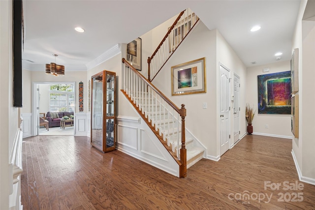 16833 Rudence Ct, Charlotte, NC 28278 - entryway featuring stairway, wood finished floors, a decorative wall, ornamental molding, and recessed lighting