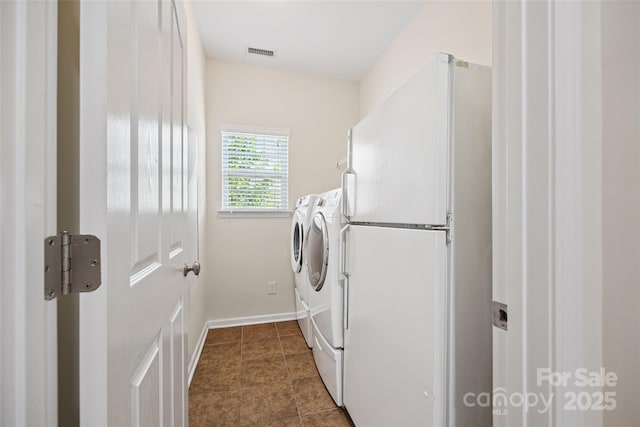16833 Rudence Ct, Charlotte, NC 28278 - laundry area with washer and dryer and baseboards