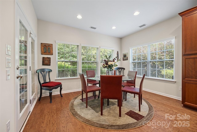 16833 Rudence Ct, Charlotte, NC 28278 - dining space with light wood-style flooring and recessed lighting