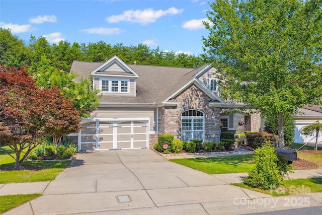 16833 Rudence Ct, Charlotte, NC 28278 - view of front facade featuring driveway, a garage, stone siding, and roof with shingles