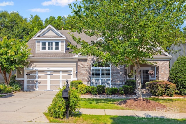 16833 Rudence Ct, Charlotte, NC 28278 - obstructed view of property featuring brick siding, an attached garage, concrete driveway, and roof with shingles