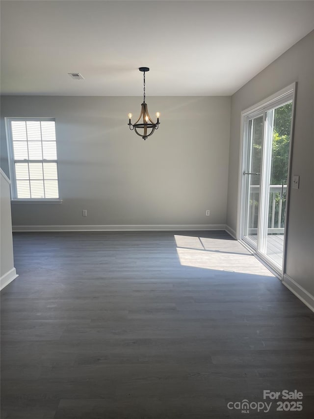 961 Poplar Forest Rdg, Clover, SC 29710 - spare room with a chandelier and dark wood-style floors