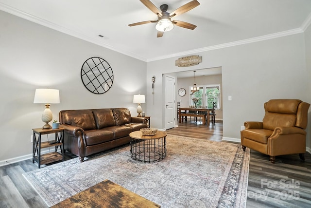 280 Mills Creek Rd, Iron Station, NC 28080 - living room featuring wood finished floors, a ceiling fan, ornamental molding, and a chandelier