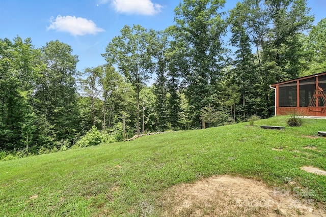 280 Mills Creek Rd, Iron Station, NC 28080 - view of grassy yard with a sunroom and a wooded view