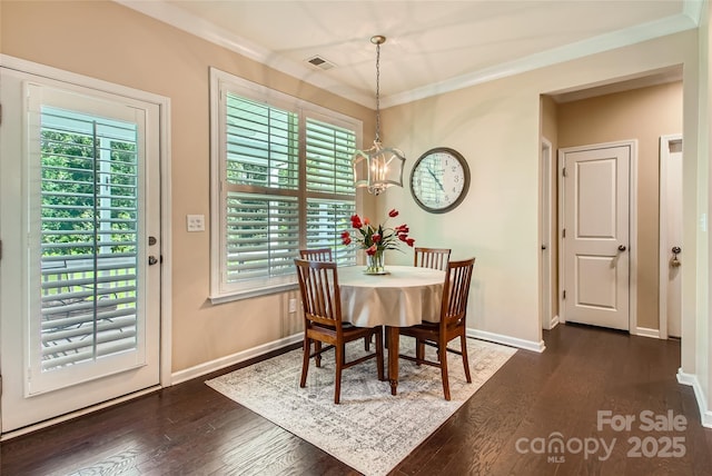 2599 Treeline Dr, Concord, NC 28027 - dining space featuring a chandelier, dark wood finished floors, and crown molding