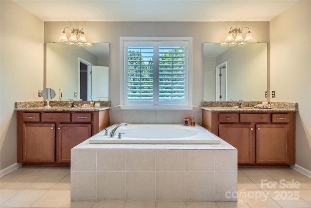 2599 Treeline Dr, Concord, NC 28027 - full bath featuring a bath, tile patterned floors, two vanities, and a chandelier