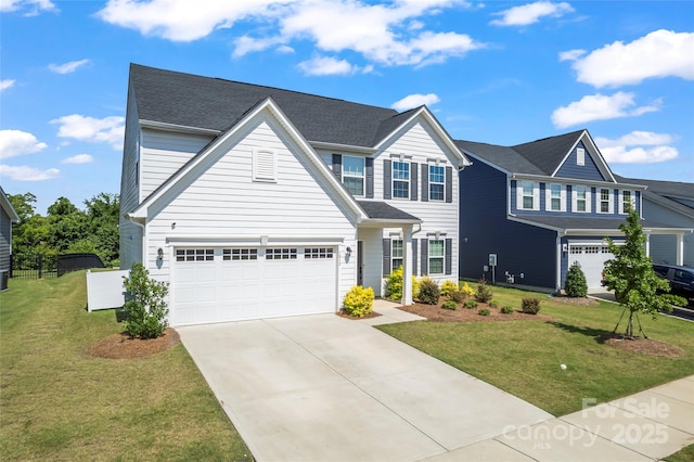 1013 Augustus Beamon Dr, Indian Trail, NC 28079 - traditional-style house with driveway, a front lawn, and an attached garage
