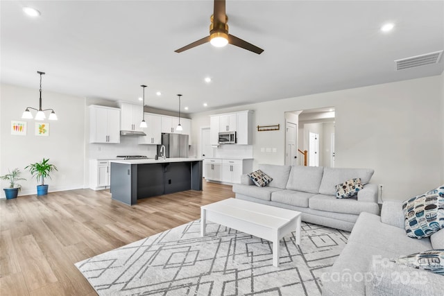 1013 Augustus Beamon Dr, Indian Trail, NC 28079 - living room featuring a ceiling fan, light wood-type flooring, and recessed lighting