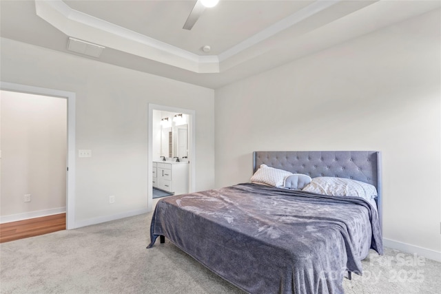 1013 Augustus Beamon Dr, Indian Trail, NC 28079 - carpeted bedroom with a raised ceiling, ensuite bathroom, a ceiling fan, and ornamental molding