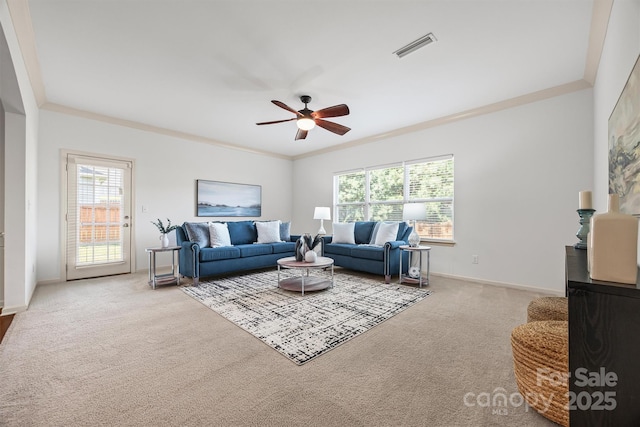 9706 Thyme Ct, Charlotte, NC 28214 - living area featuring carpet floors, healthy amount of natural light, a ceiling fan, and crown molding