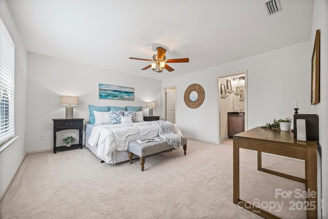 9706 Thyme Ct, Charlotte, NC 28214 - bedroom with light colored carpet, ceiling fan, and ensuite bath