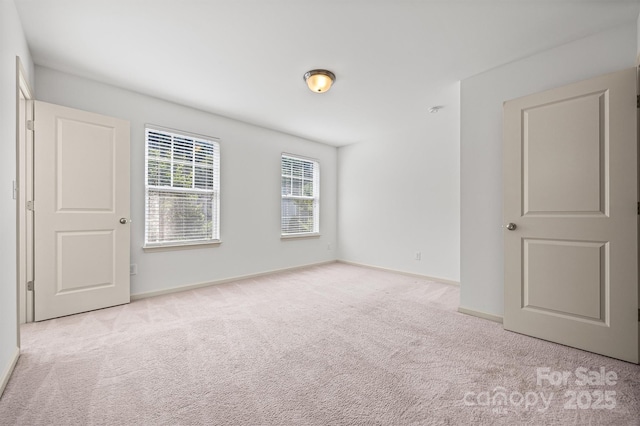 9706 Thyme Ct, Charlotte, NC 28214 - carpeted spare room featuring baseboards