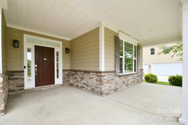 551 Brightleaf Pl NW, Concord, NC 28027 - property entrance with stone siding and a porch