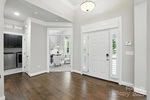 551 Brightleaf Pl NW, Concord, NC 28027 - entrance foyer with washer and clothes dryer, dark wood-style floors, ornamental molding, and recessed lighting