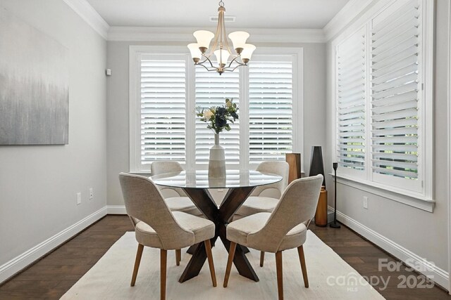 551 Brightleaf Pl NW, Concord, NC 28027 - dining area with a chandelier, wood finished floors, and ornamental molding