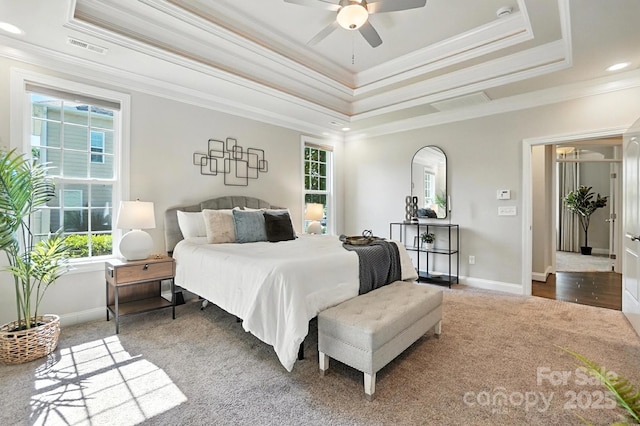 551 Brightleaf Pl NW, Concord, NC 28027 - bedroom with multiple windows, carpet floors, a tray ceiling, crown molding, and recessed lighting
