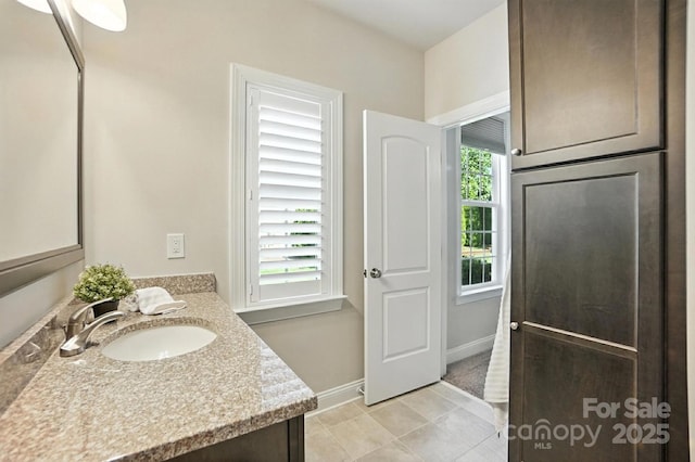 551 Brightleaf Pl NW, Concord, NC 28027 - bathroom with vanity and tile patterned floors