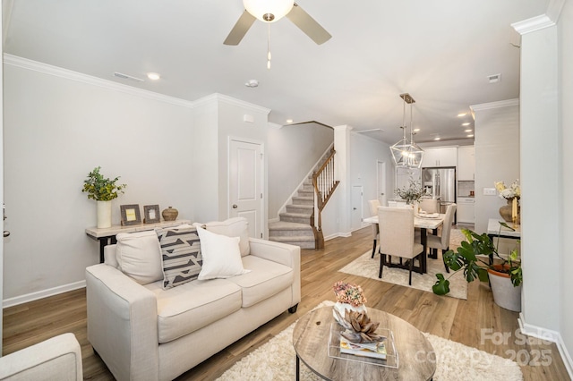 508 Morrows Turnout Way Unit 97, Pineville, NC 28134 - living area featuring recessed lighting, light wood-style flooring, stairway, crown molding, and ceiling fan