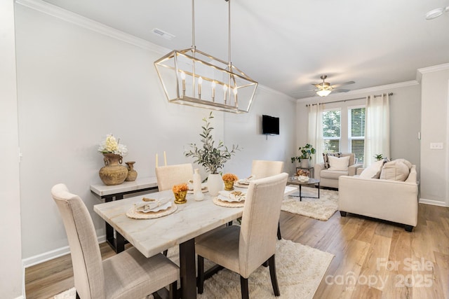 508 Morrows Turnout Way Unit 97, Pineville, NC 28134 - dining room featuring light wood-style floors, crown molding, and ceiling fan