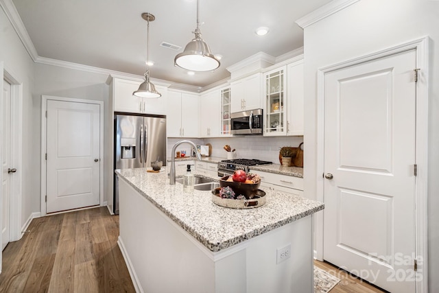 508 Morrows Turnout Way Unit 97, Pineville, NC 28134 - kitchen with stainless steel appliances, wood finished floors, glass insert cabinets, decorative backsplash, and crown molding
