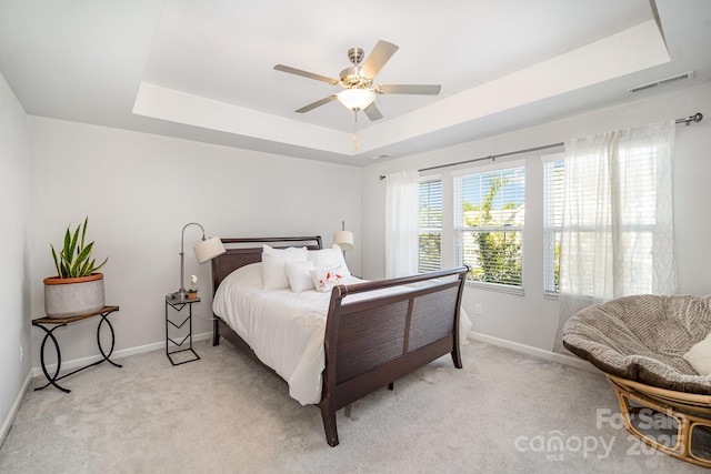 508 Morrows Turnout Way Unit 97, Pineville, NC 28134 - bedroom with a raised ceiling, light colored carpet, and a ceiling fan